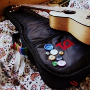 My ukulele and its button case